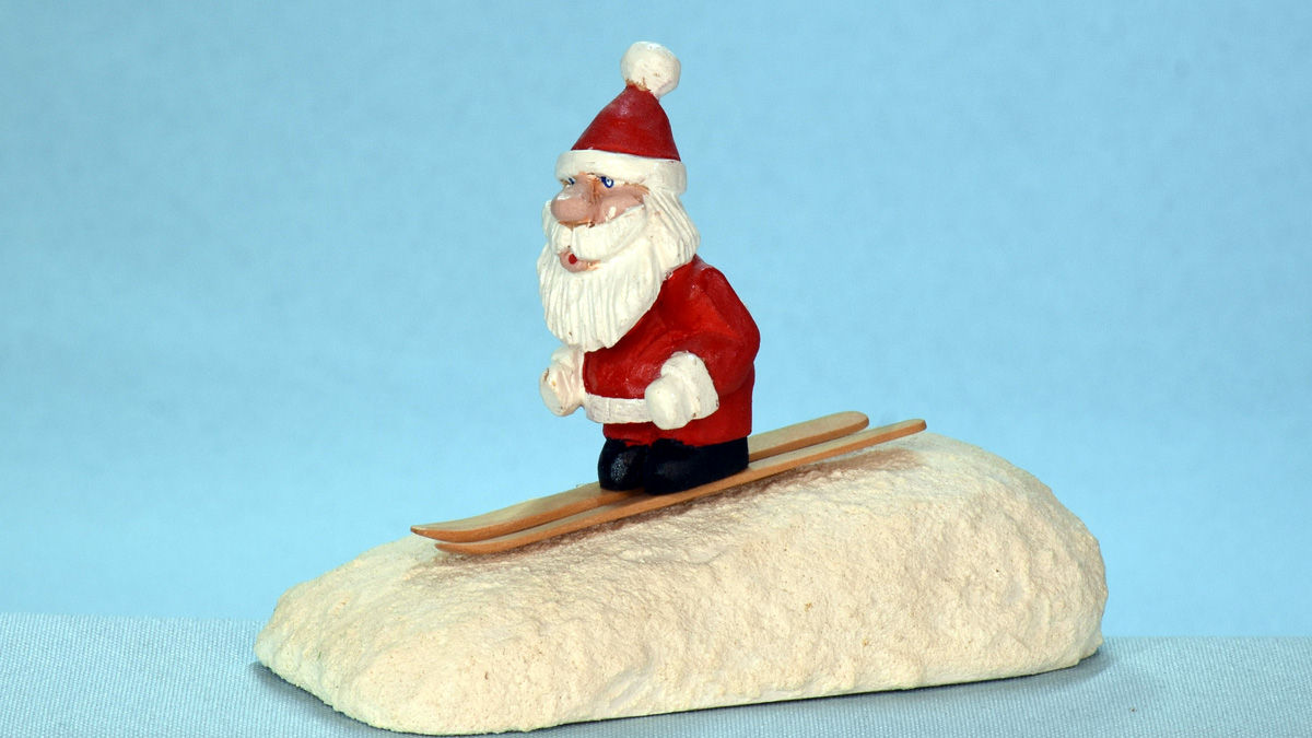 Santa is skiing, carved and painted by Al Furtado.
