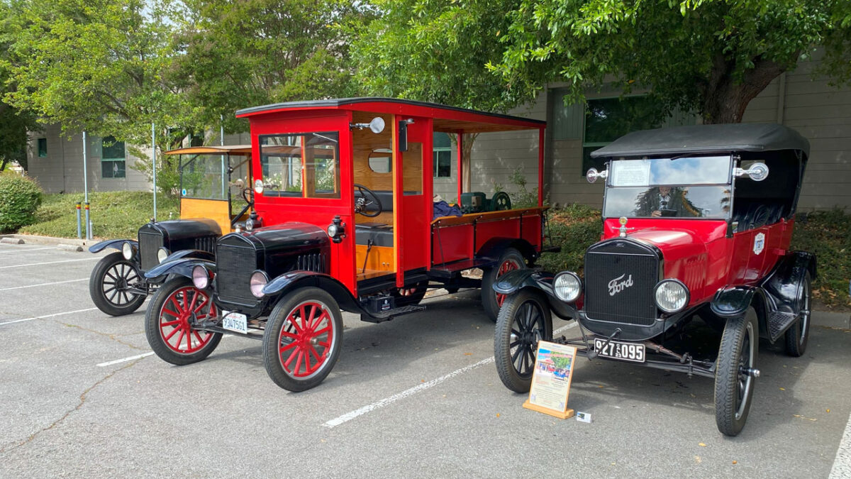 Three antique cars