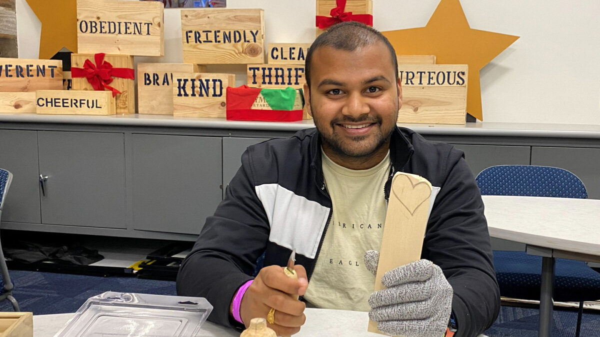 Avaneesh whittles a heart