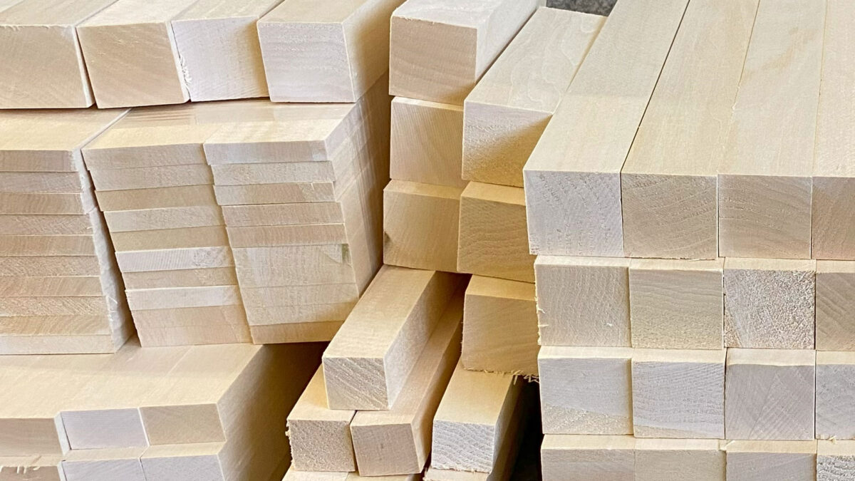 Dozens and dozens of basswood blocks are stacked and ready for carving.