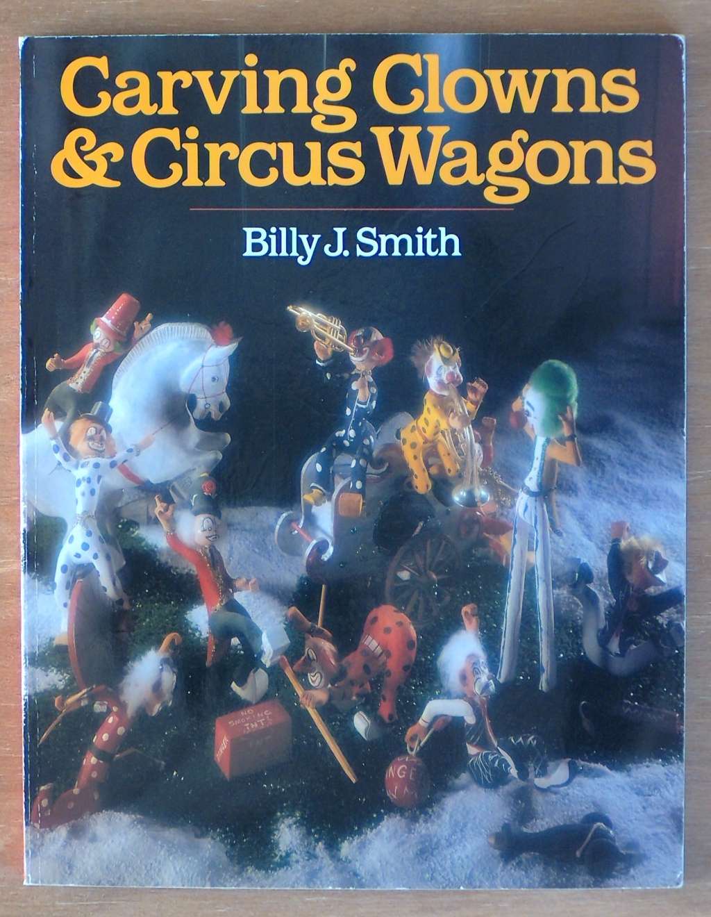 An image of a woodcarving book cover: Carving Clowns & Circus Wagons by Billy J. Smith
