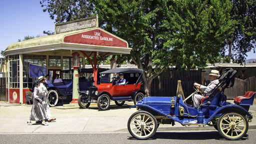 Antique cars at the gas station.