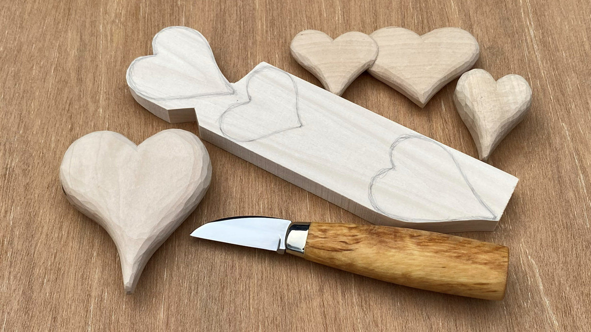 A few whittled hearts and a woodcarving knife.