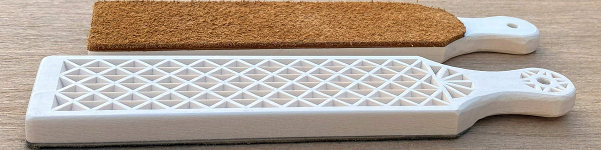 Two leather strops decorated with a simple chip carving pattern. Find the chip carving pattern at https://readntry.com