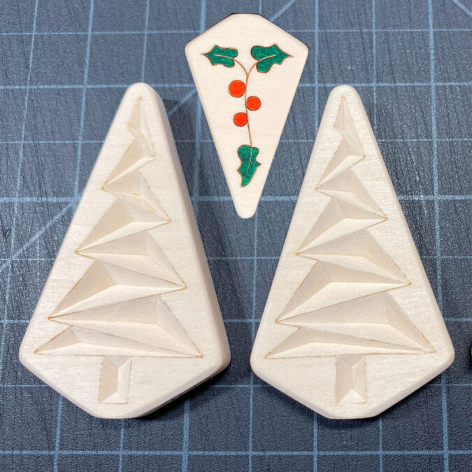 Chip carved trees carved by Roman Chernikov in 2023.