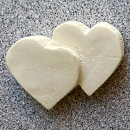 Two linked hearts carved from basswood by Connie Wilson.