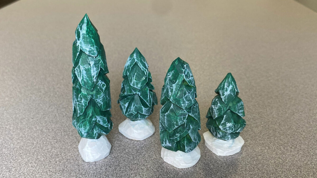 Four carved and painted fir trees to share in the SCVC woodcarving newsletter.
