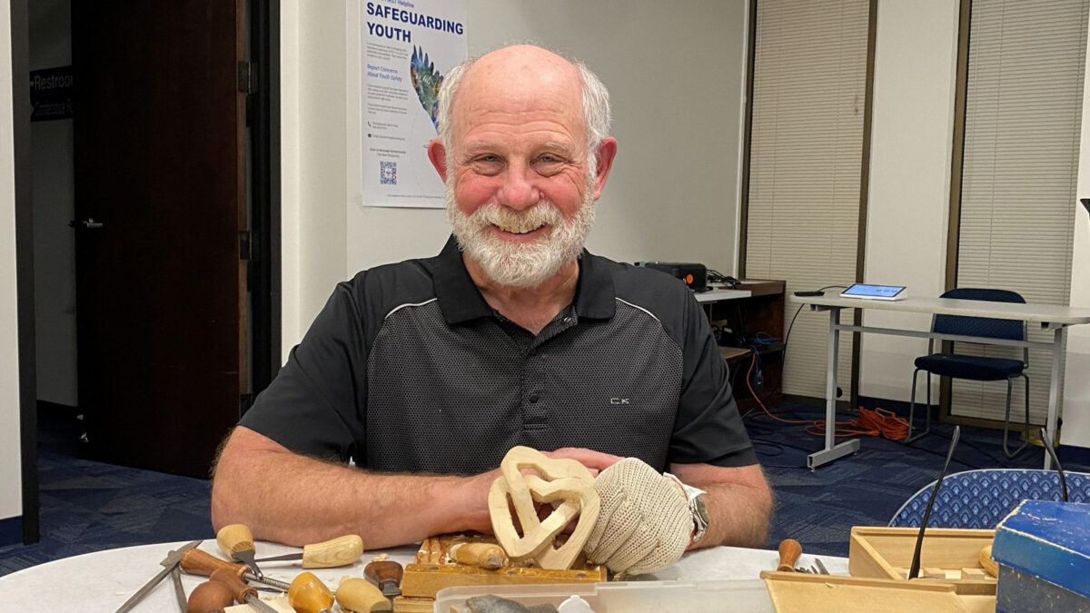 Dan is carving linked hearts after attending our Valentine's Day woodcarving workshop.