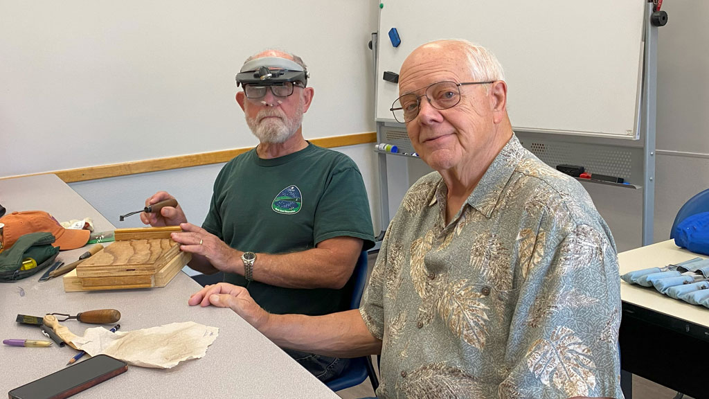 Dan and Gary use checkering tools.