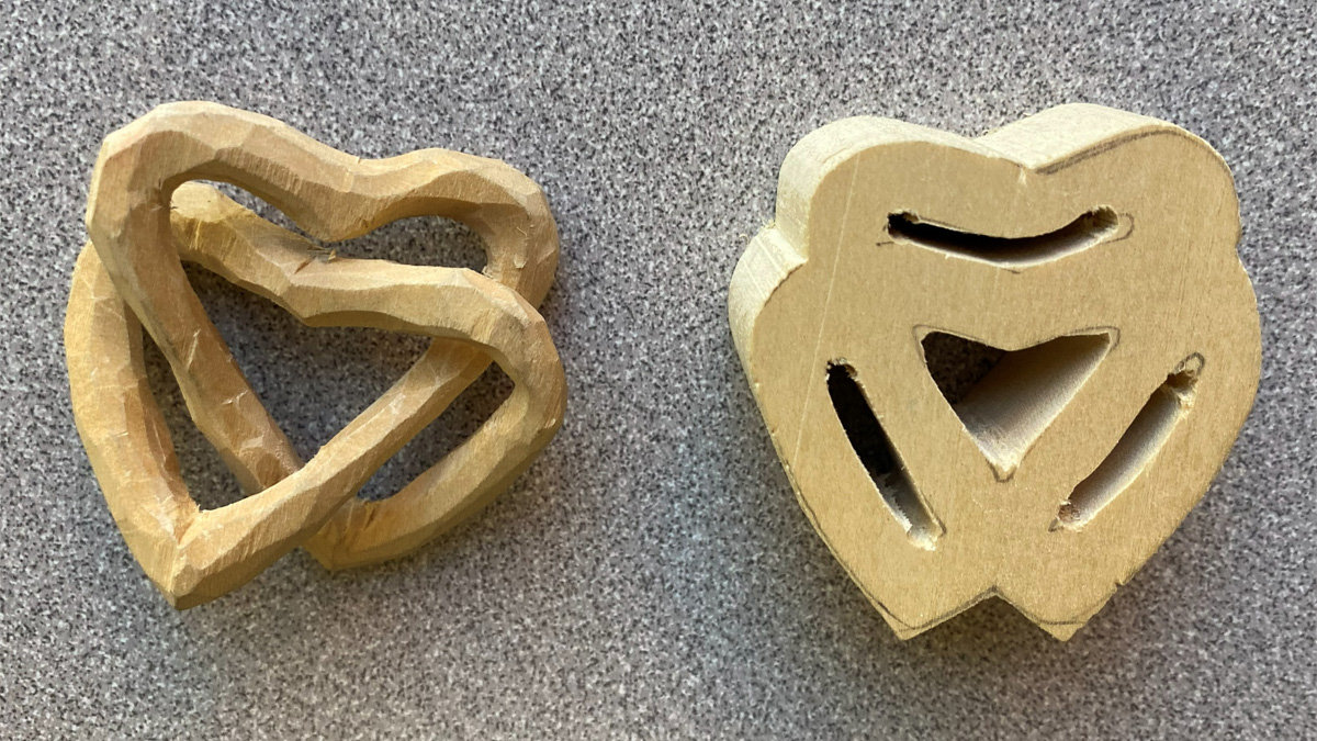 A carving of interconnected hearts and a pattern blank for the project.