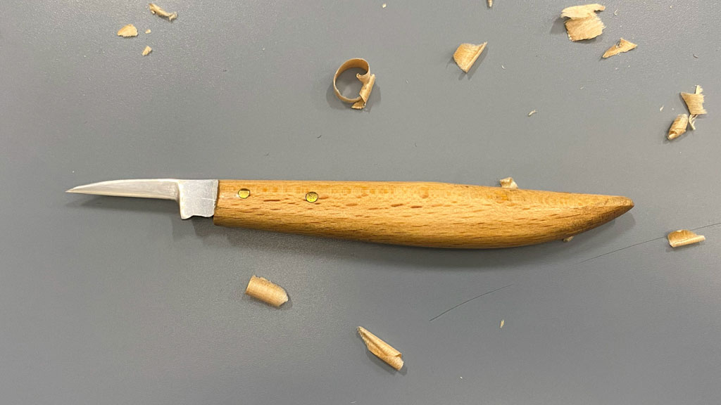 Small detail carving knife with a narrow blade.