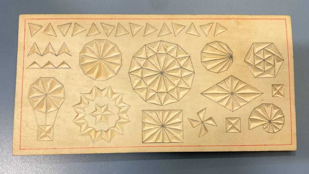 Rosette chip carving practice board carved by David Clarke. The practice boards are available for purchase at https://readntry.com