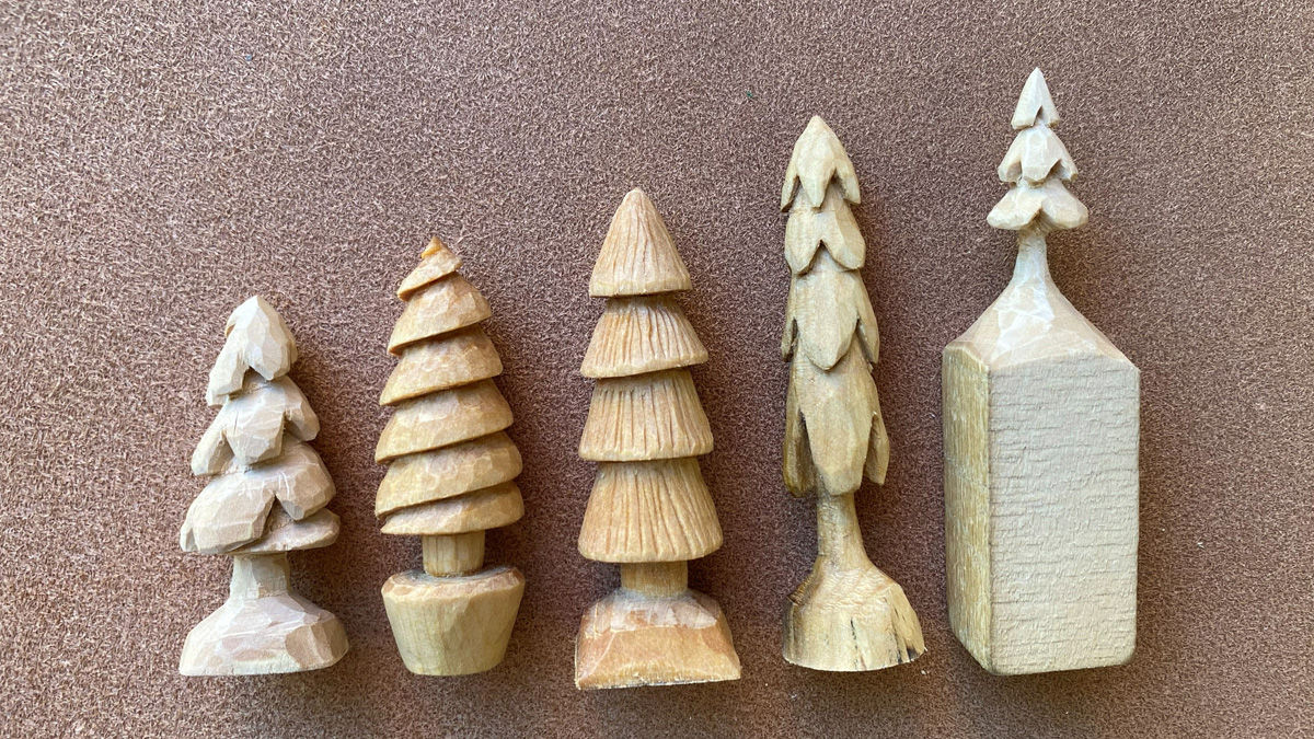 A set of five tree ornaments, each carved using a different technique from basswood. David Clarke, a member of our woodcarving club, carved and finished those quick whittling projects with oil. They are 3-5 inches long.