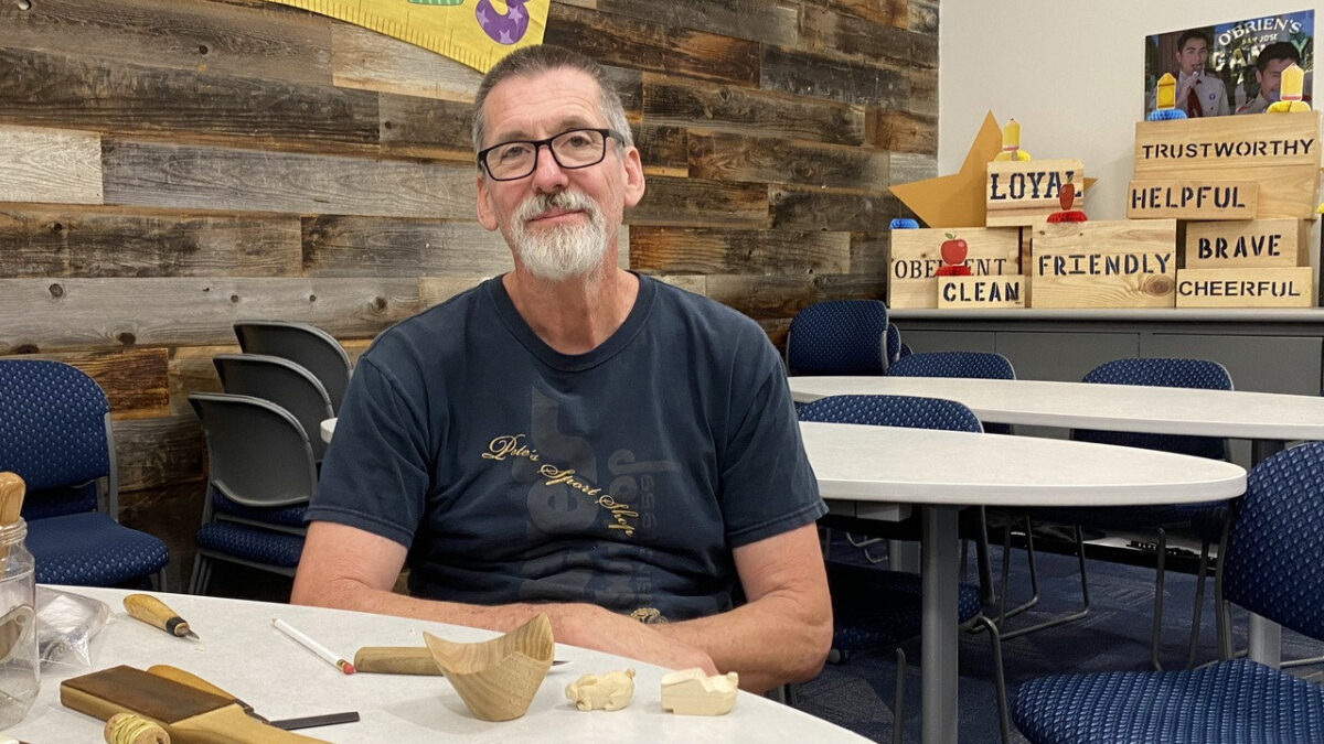 David Clarke displays his woodcarving and woodturning projects, including carved rabbits and a wooden bowl, during a Santa Clara Valley Carvers meeting in San Jose, CA.