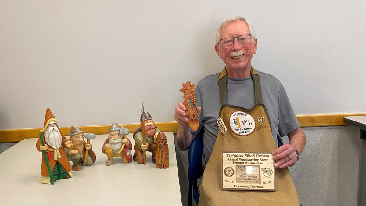 David is holding the grape leaf love spoon and the award he won at the Tri-Valley Carvers show. The photo was taken for the SCVC woodcarving newsletter.