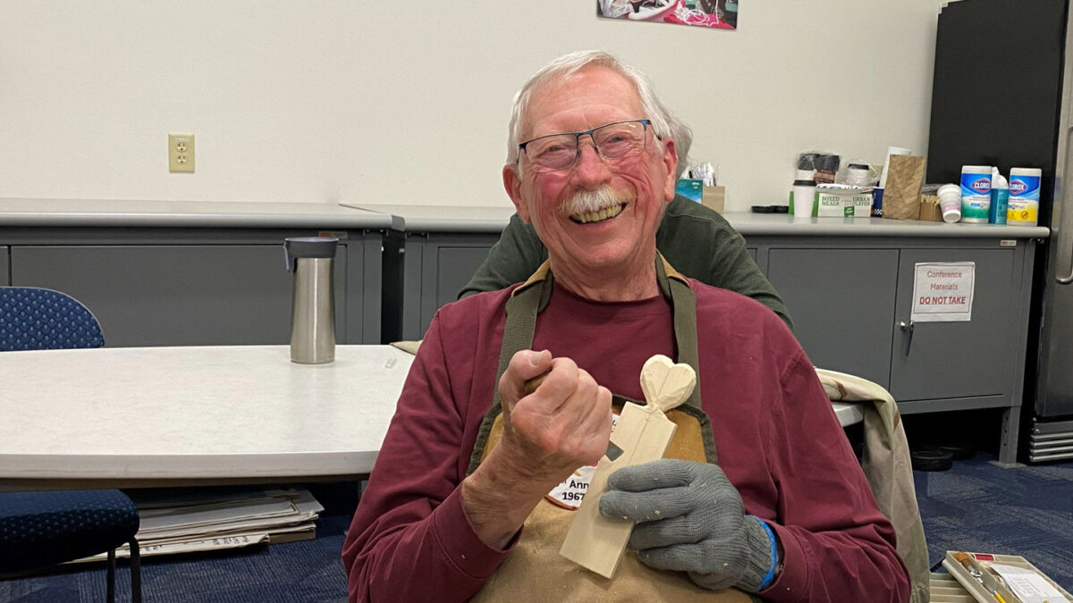 David carves a simple heart with a gouge.