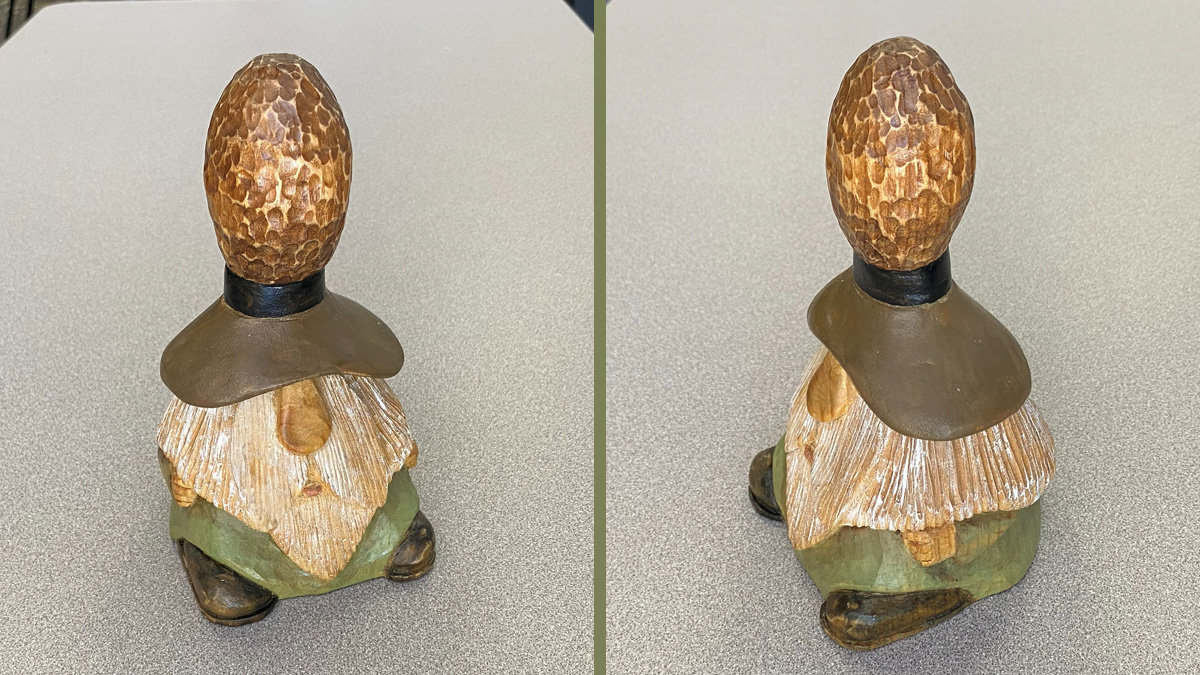 A split image displaying two angles of a small woodcarved gnome figurine created by David Osterlund. The figure features a large, bulbous hat with a rough, mottled brown texture, a long beard carved from light-colored wood with visible grain lines, and a green tunic with dark brown boots. The left panel shows the front-left side of the gnome, while the right panel shows the back-right side.