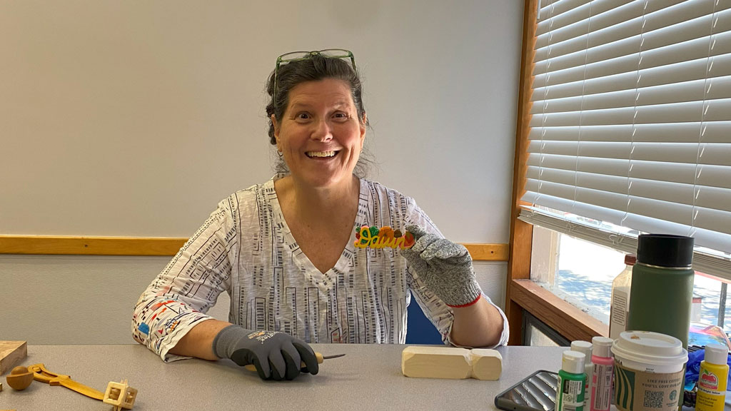 Dawn is holding her handmade name tag