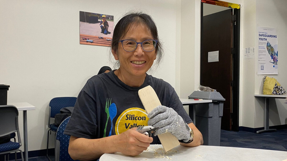 Dee carves a basswood block using a carving knife and protective glove at a Santa Clara Valley Carvers club meeting in San Jose, CA.