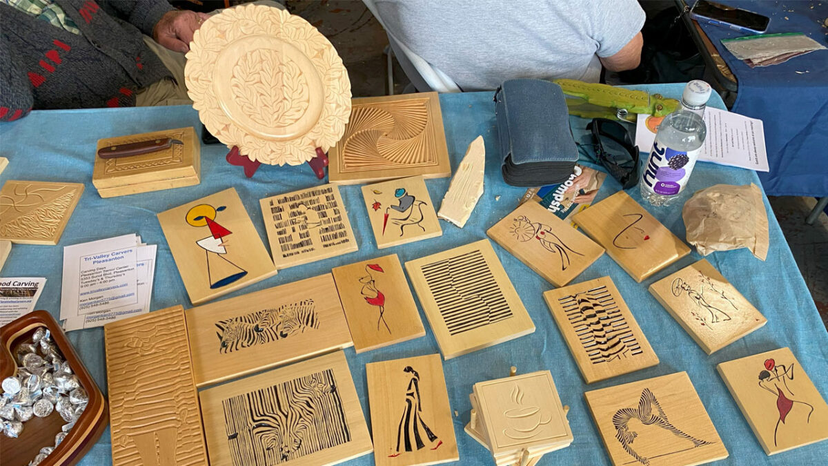A table with a dozen chip-carved panels by Ed Heskett.