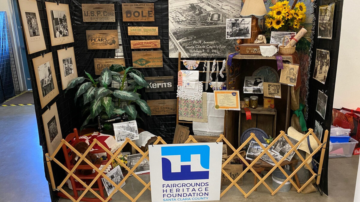 The Fairgrounds Heritage Foundation's historical exhibit at the Santa Clara County Fair displays vintage memorabilia, antique wooden signs, and regional heritage equipment.