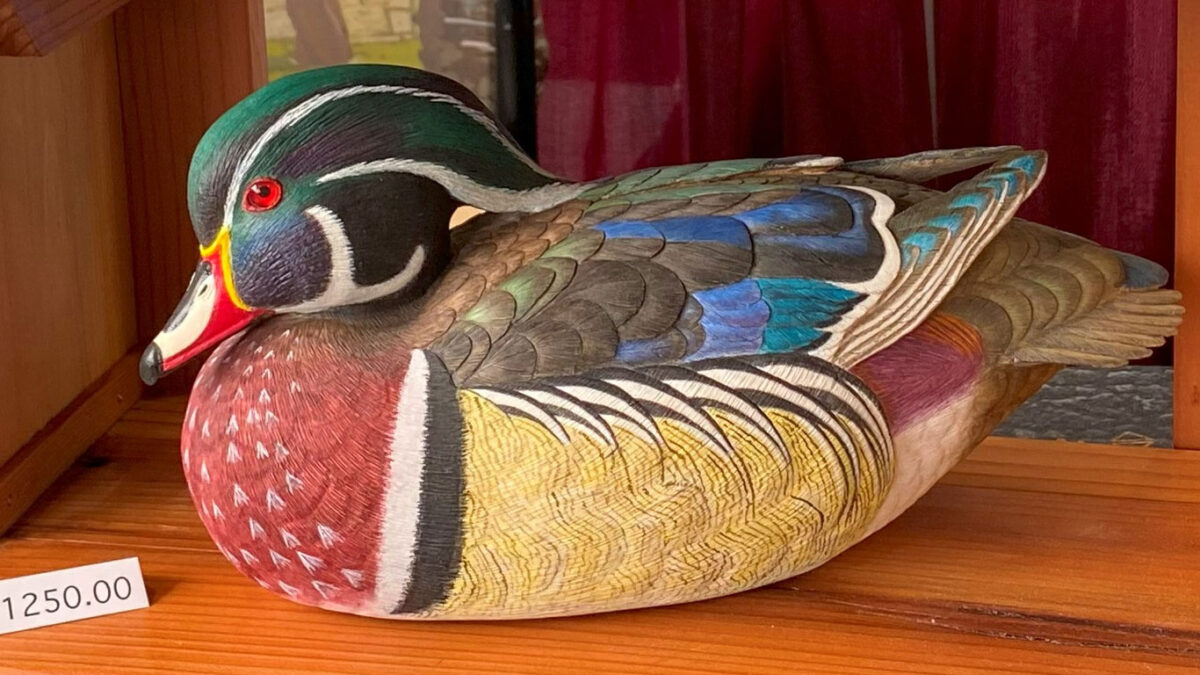 A very colorful wooden duck.