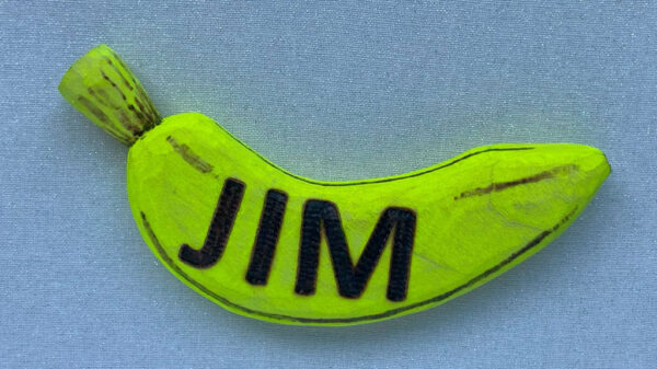 A name badge in the shape of a banana.