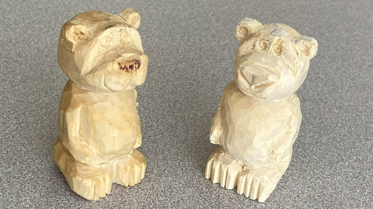 Two carved, toy-like basswood bears by Jonathan Jackel.