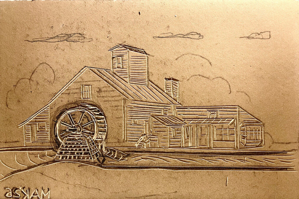 A linoleum block showing an outline carving of the Amherst Grist Mill, featuring incised lines that detail a large water wheel, building siding, a cupola, and clouds in the sky.