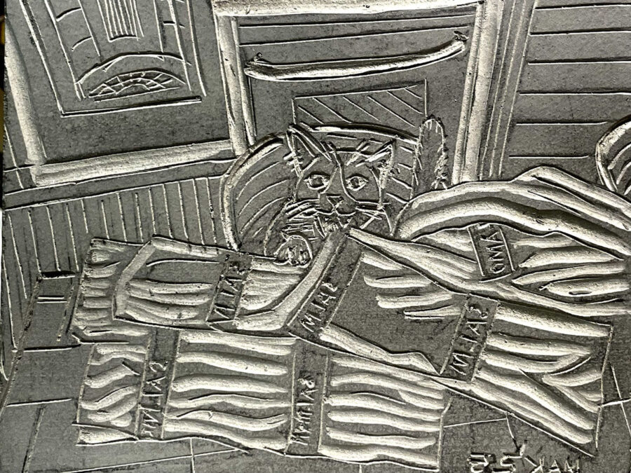 A carved linoleum block for printing.