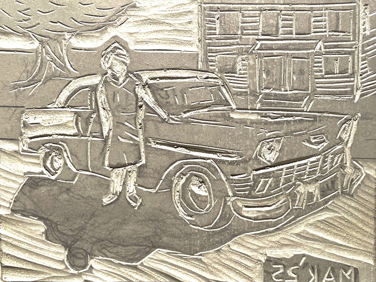 A carved linoleum block for printing.