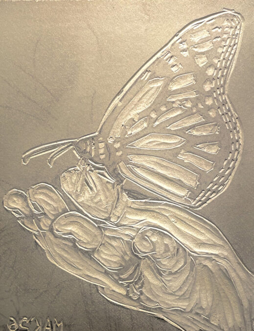A butterfly design carved into a linoleum block for block printing
