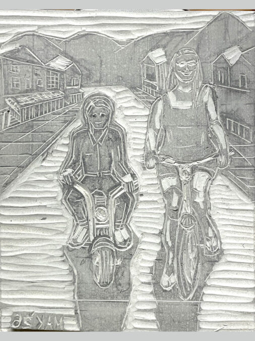 A carved linoleum block for printing of a minibike rider and a bicycle rider.