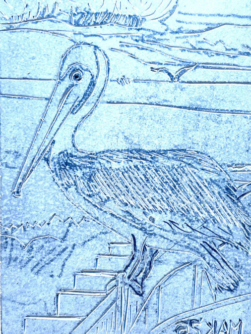 An outline carving of a large pelican standing on a railing near the water, captured as part of a linoleum block printing project by artist Jordan Makower.