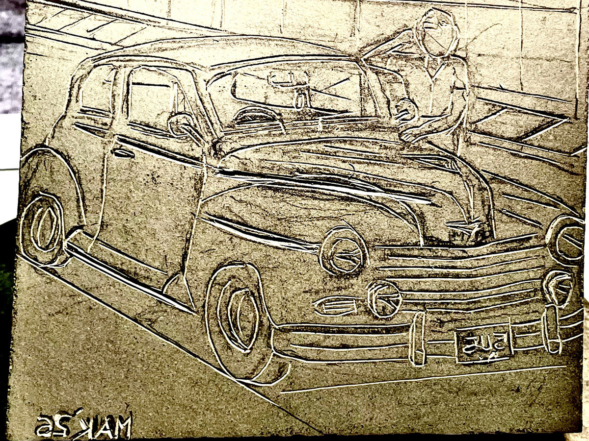 A partially carved linoleum block depicting a vintage sedan, identified by the filename as a Plymouth Deluxe, angled toward the right. A figure leans casually against the hood of the car, looking upward with one hand near their head. The vehicle features prominent rounded fenders, large headlights, and horizontal grille slats, with a license plate reading "5115" visible on the front bumper.