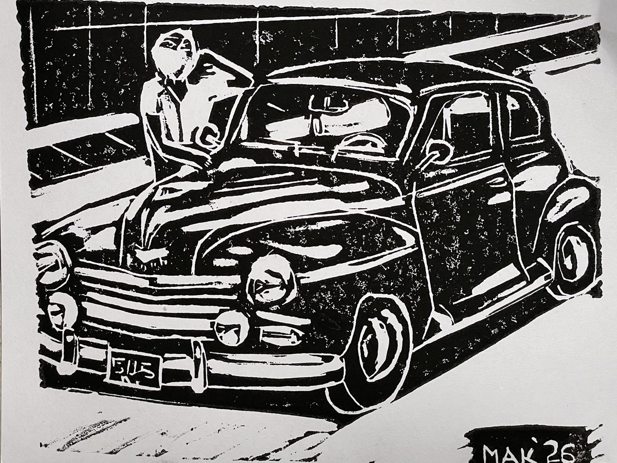 A high-contrast black-and-white linoleum block print depicting a vintage sedan, identified by the filename as a Plymouth Deluxe, angled toward the left. A figure leans casually against the hood of the car, looking upward with one hand near their head. The vehicle features prominent rounded fenders, large headlights, and horizontal grille slats, with a license plate reading "5115" visible on the front bumper. The image has a grainy texture characteristic of relief printing and is signed "MAK '26" in the bottom right corner. It was printed in 2026.