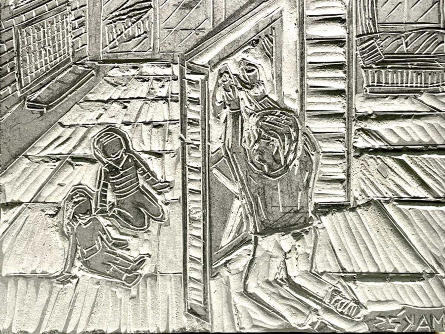 A carved linoleum block for printing.