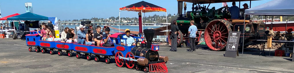 Toy train with passengers at Maker Faire at Mare Island, Vallejo, CA