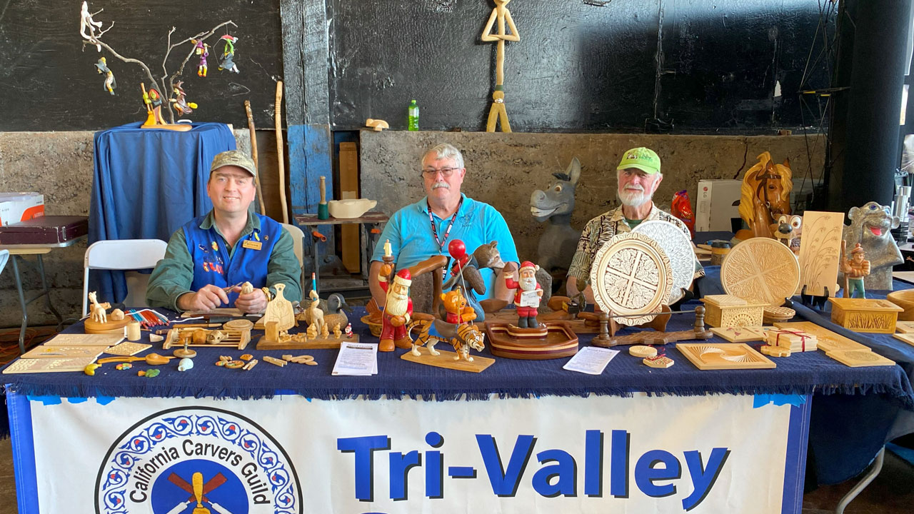 Woodcarving at Maker Faire 2024. Left to right: Roman Chernikov, Ken Morgan, Ed Heskett