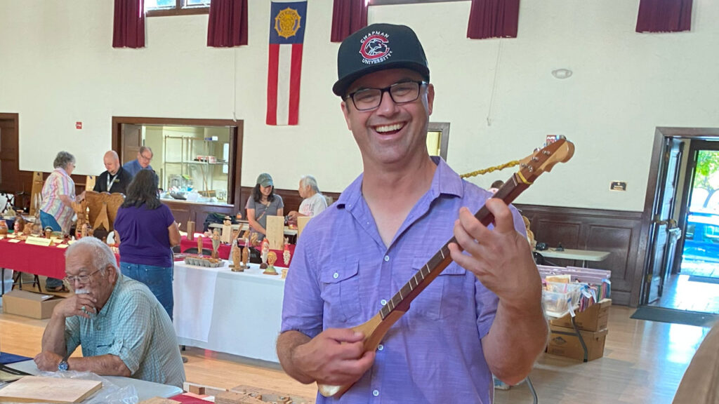 Morgan Heskett makes musical instruments. He played one of them at the TVC Woodcarving Show in September 2025 in Pleasanton, CA.