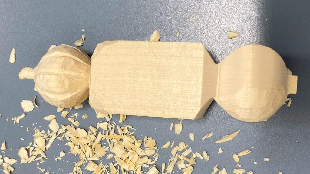 A piece of basswood with two carved pumpkins on both ends. Work in progress.