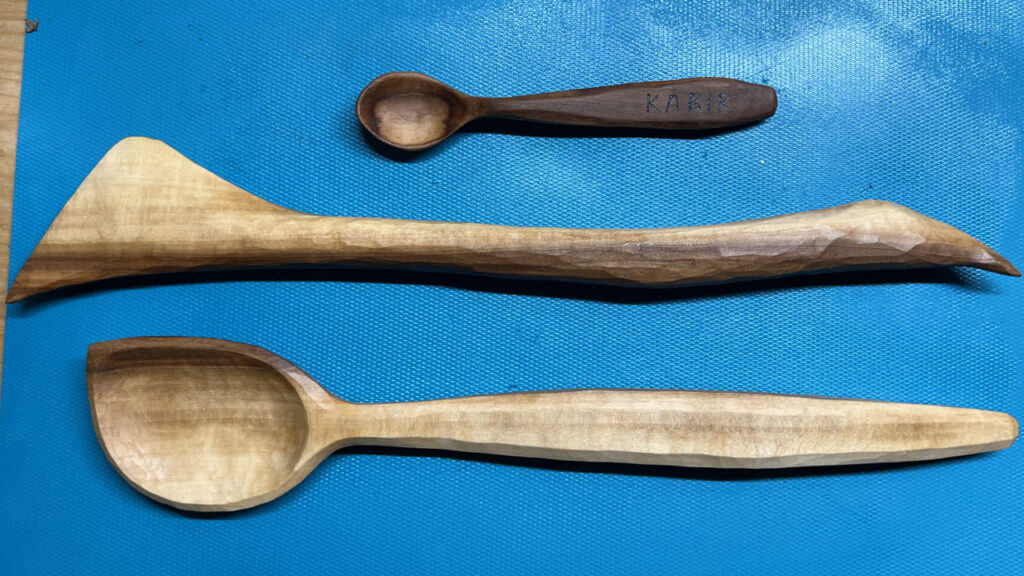 Hand-carved kitchen trinkets: spoons and spatulas.