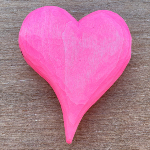A simple heart whittled from basswood and painted bright pink by Roman Chernikov.