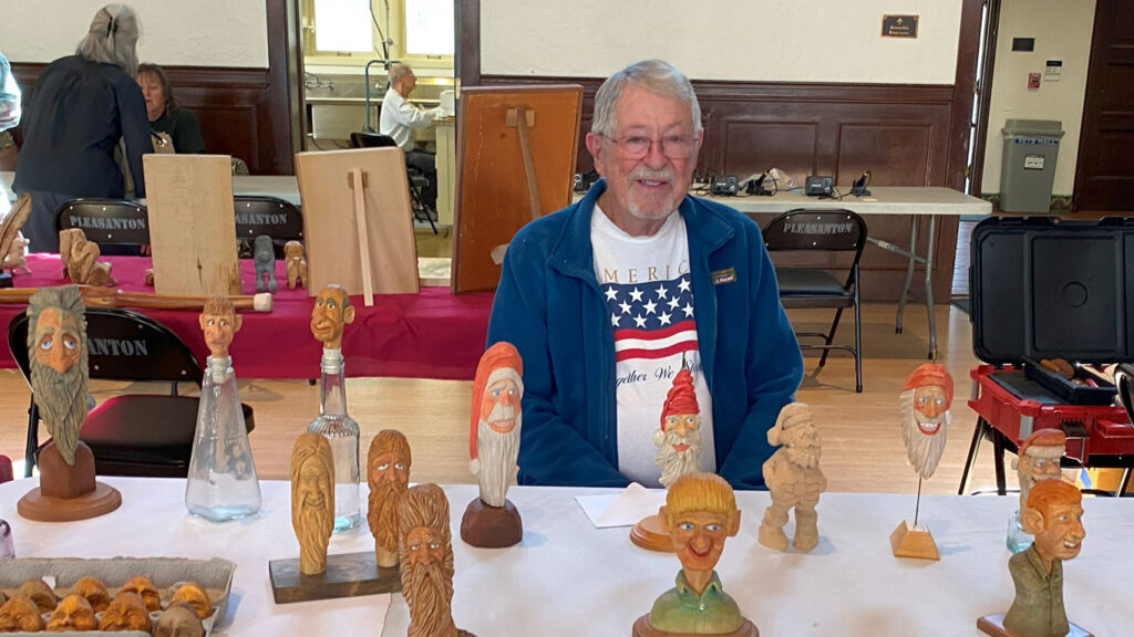 Ron Richards set up a table full of caricature carvings at the TVC Woodcarving Show in September 2025.