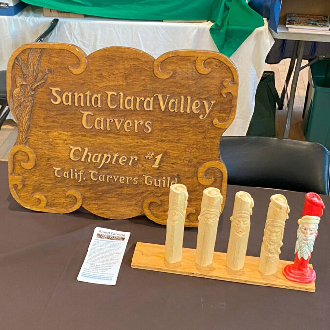 Large woodcarved plaque for Santa Clara Valley Carvers and the progression of candle carving.