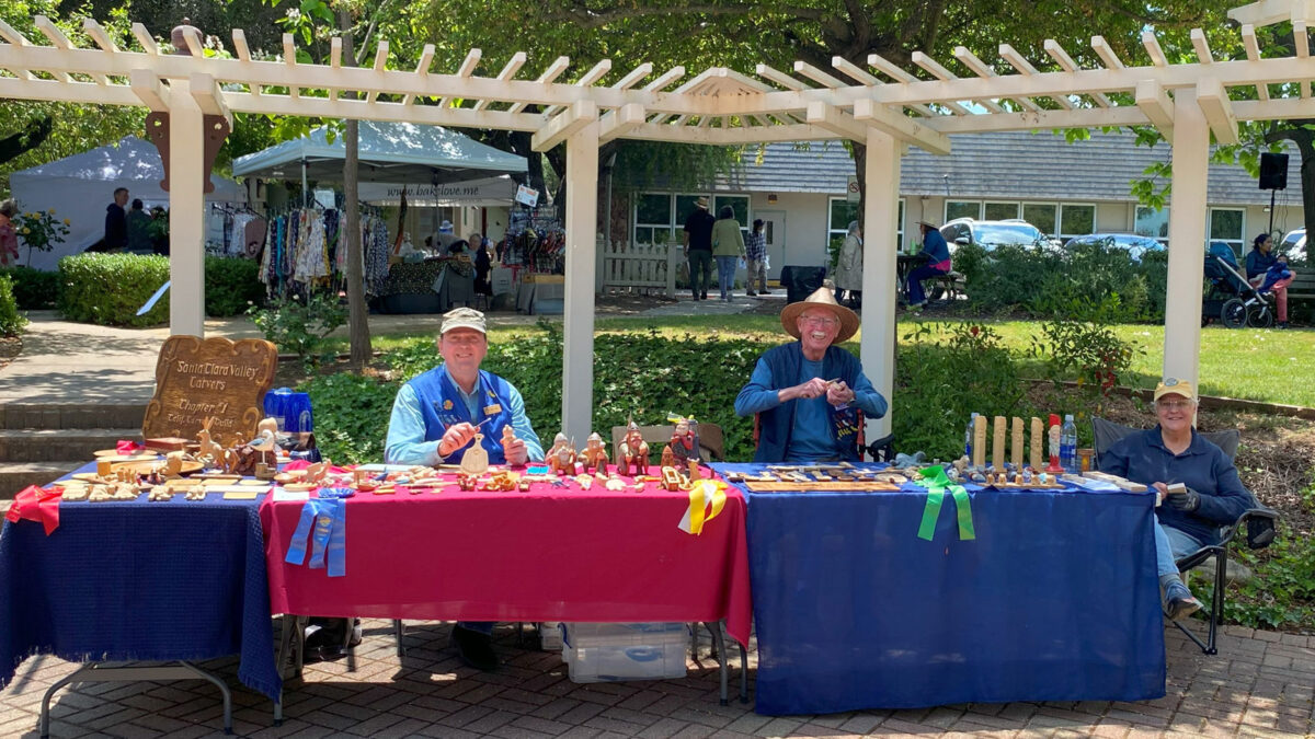 The Santa Clara Valley Carvers present woodcarving at Saratoga Blossom Festival. Left to right: Roman Chernikov, David Osterlund, Connie Wilson.