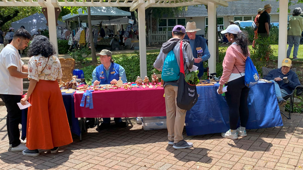 SCVC's woodcarving booth at Saratoga Blossom Festival, 2025.