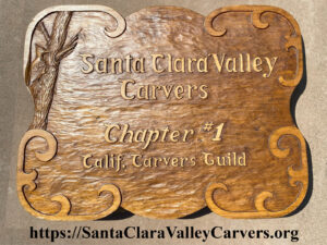 A hand carved wooden sign with this text: Santa Clara VAlley Carvers, Chapter #1, Calif. Carvers Guild