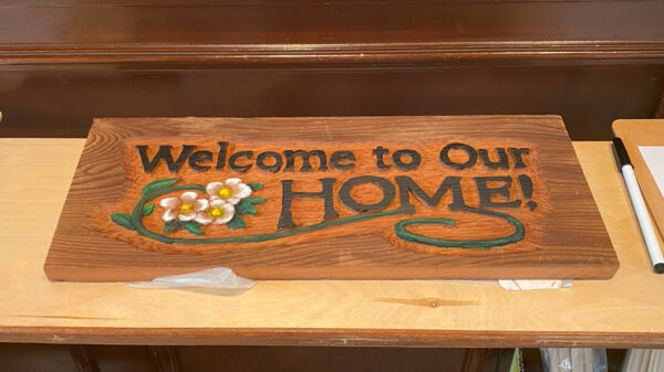 "Welcome to Our Home" carved sign. It came from Gerry Jensen.