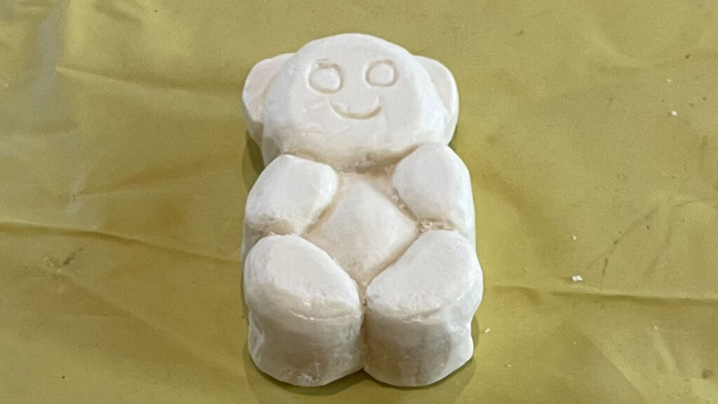 A soap bar carved into a simple bear.